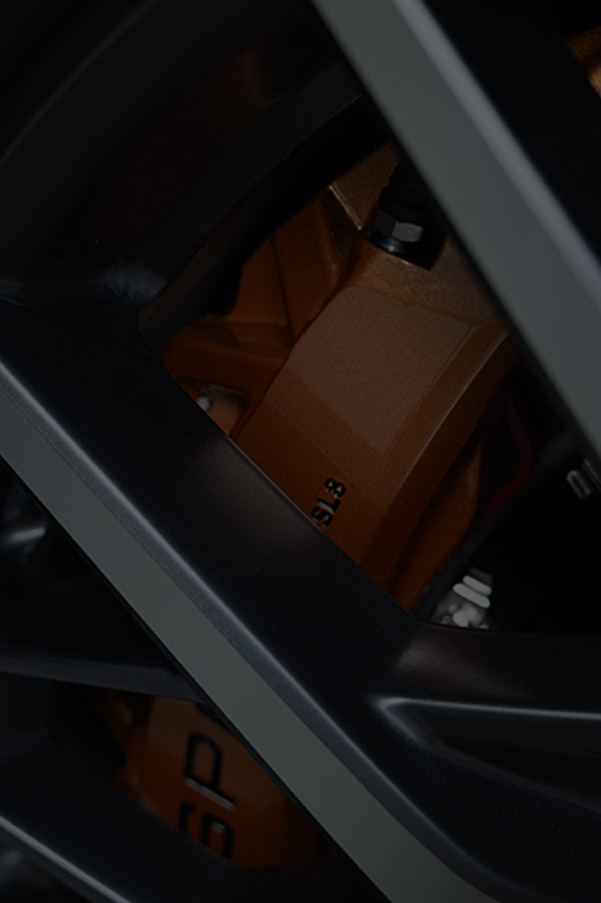 An orange TTSPORT Slim Series 8-piston big brake kit.