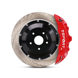 Close-up of a red TTSPORT SL6 6-piston forged brake caliper for the front wheel and a slotted 2-piece floating rotor.