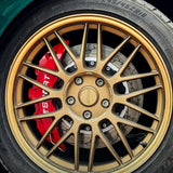 A red TTSPORT SL6 6-piston big brake kit is installed on the 18" front wheel.